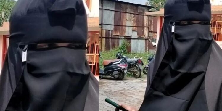 বোৰ্খা পিন্ধি ৰাস্তাত এজন যুৱক, স্থানীয় ৰাইজে লপা-থপা দি গোটালে আৰক্ষীক
